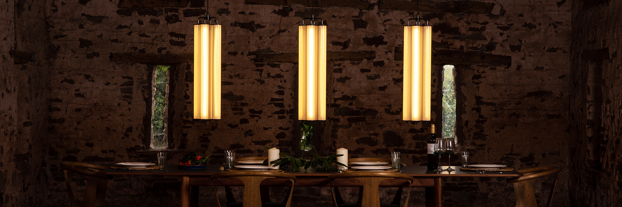 Fritz Fryer Alton Pillar Light Pendants hung over a dining table