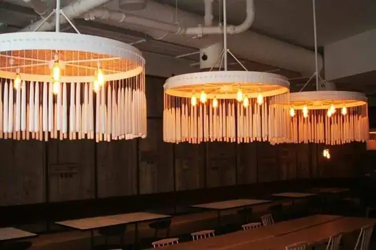 Contemporary circular pendant lights with warm lighting, ideal for stylish interior spaces.