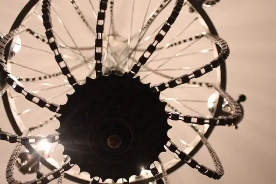 Modern chandelier with black and white striped arms.
