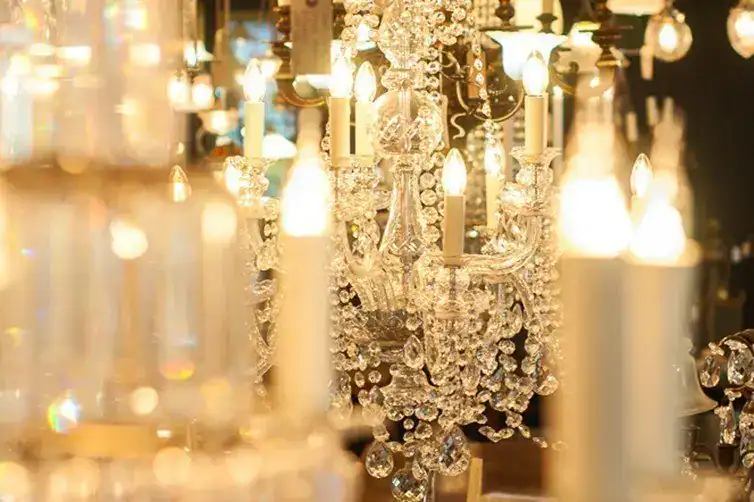 Crystal chandelier with warm lighting and intricate details.