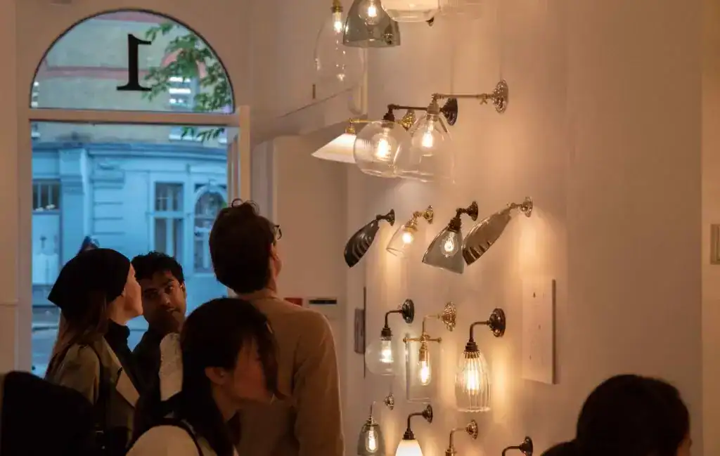 Modern wall-mounted lighting display in a showroom.