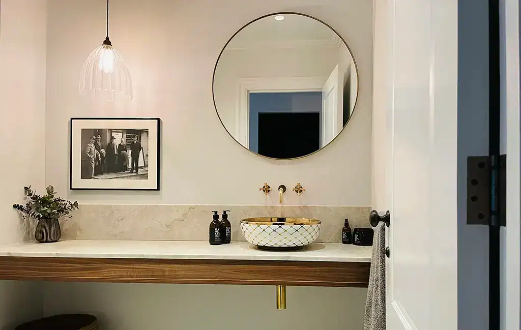 Elegant bathroom vanity with modern lighting fixtures.