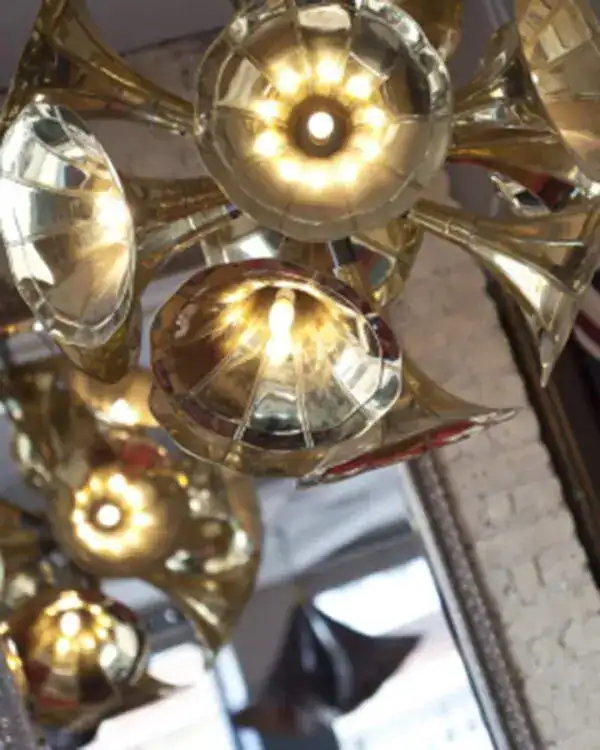 Elegant brass chandelier with multiple light bulbs.