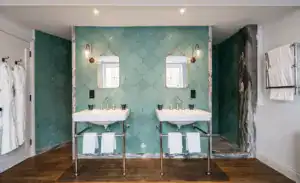 Elegant bathroom with dual sinks and modern lighting.