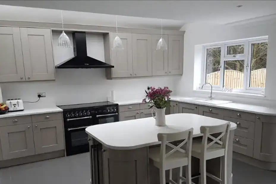 Modern kitchen with pendant lighting above island.