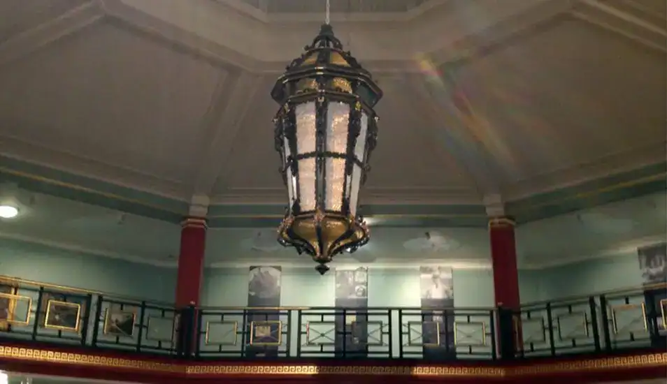 Elegant vintage chandelier in a historic building.