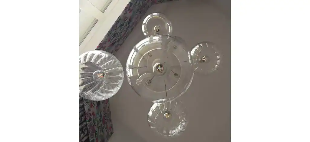 Elegant modern glass pendant light fixture with multiple spherical shades.