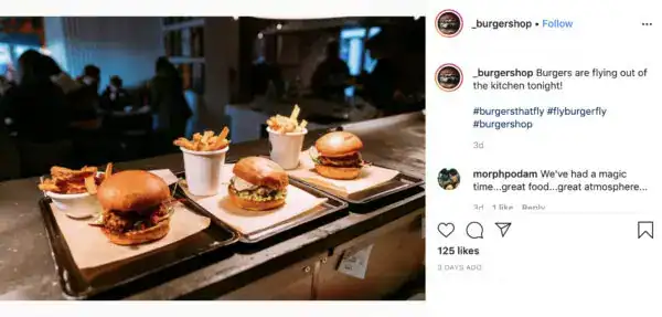 Modern burger display with fries and drinks at Fritz Fryer Lighting UK.