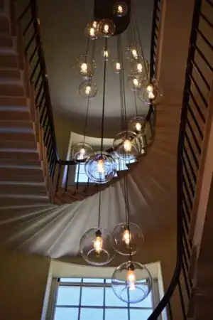 Pendant lighting with multiple glass globes hanging from the ceiling.