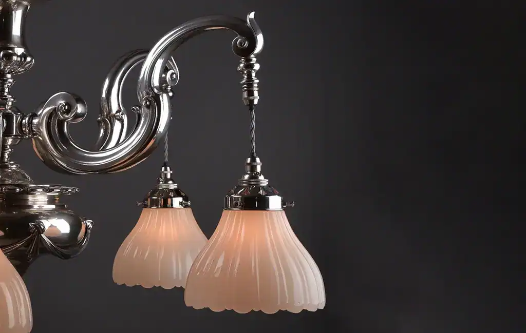 Elegant vintage chandelier with frosted glass shades.
