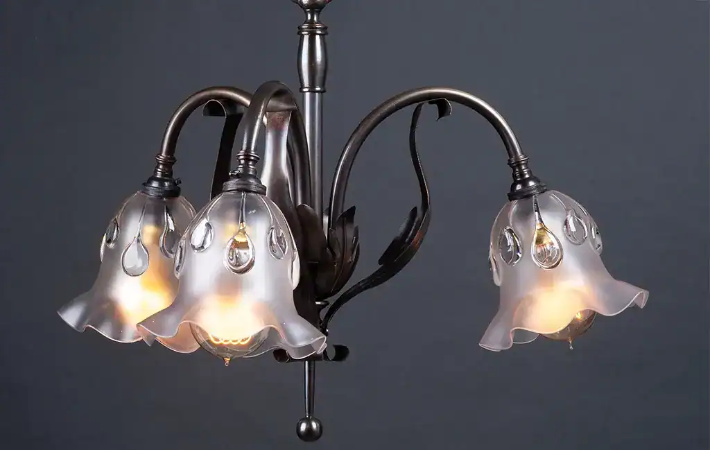 Elegant floral glass chandelier with multiple lights.