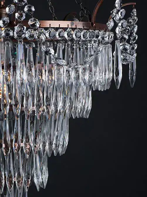 Luxurious crystal chandelier with hanging prisms and sparkling details, ideal for sophisticated inte.