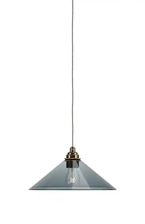 Pendant light with a glass shade and vintage-style filament bulb.