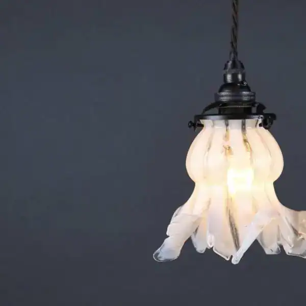 Vintage glass pendant light with floral design, ideal for stylish lighting in UK homes.