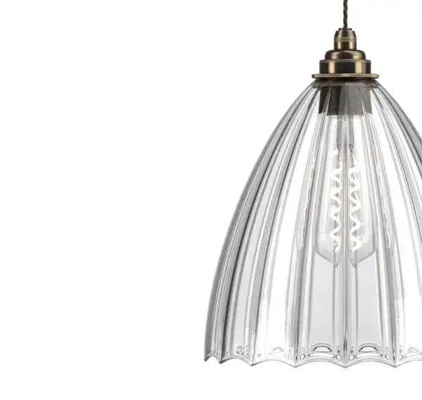Elegant vintage glass pendant light with brass fittings for stylish interiors.