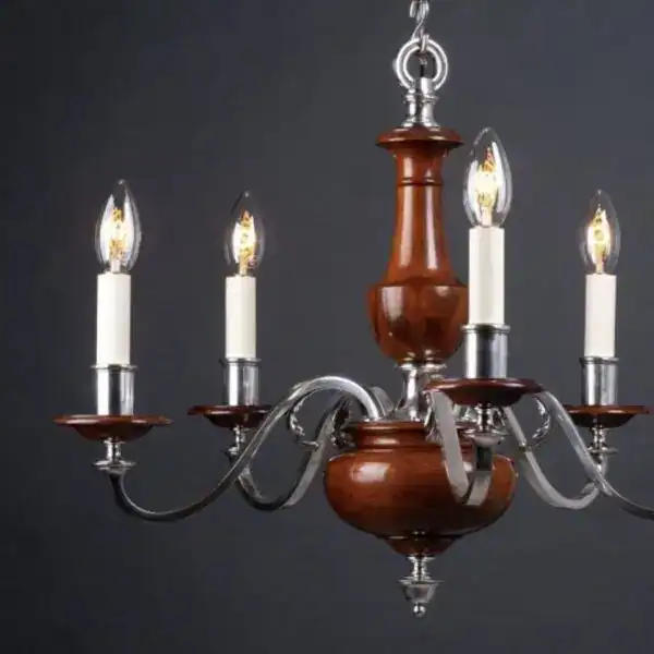Classic wooden chandelier with candle-style lights and elegant metal arms.