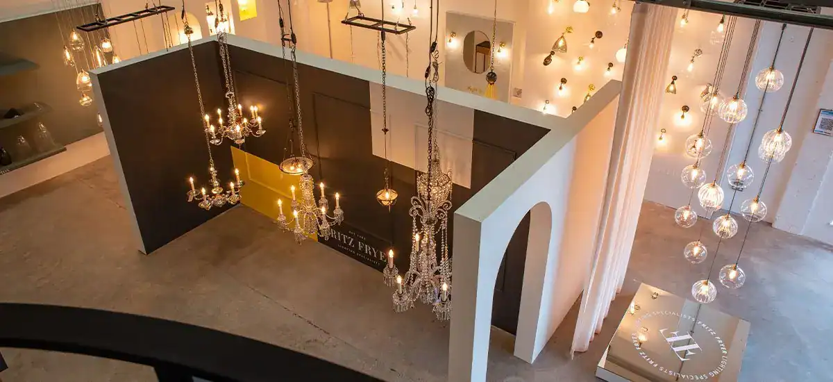 Elegant chandelier display in a modern showroom.