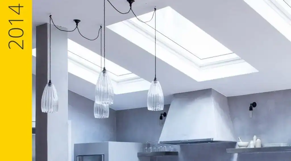 Pendant lights hanging from a modern ceiling in a contemporary kitchen.