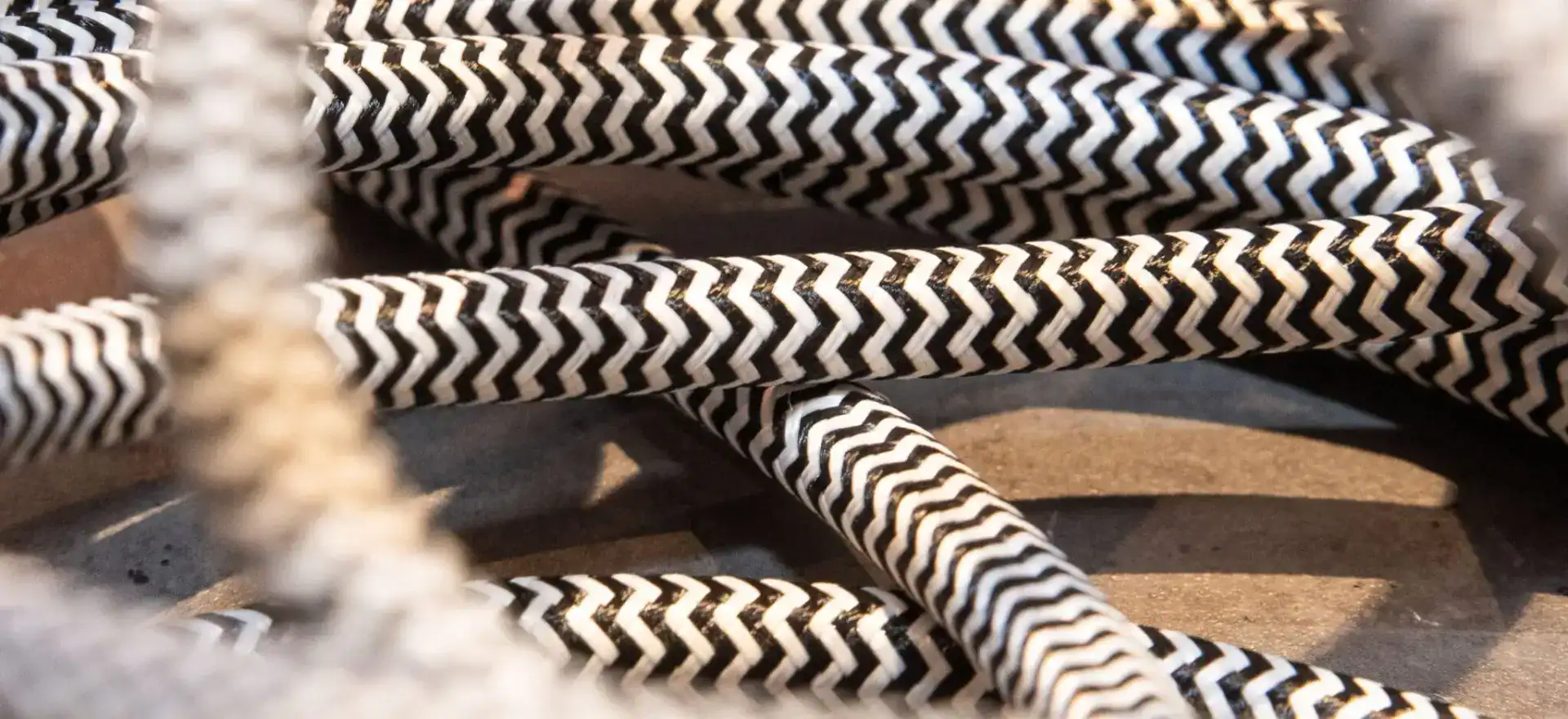 Decorative black and white zigzag patterned electrical cables.
