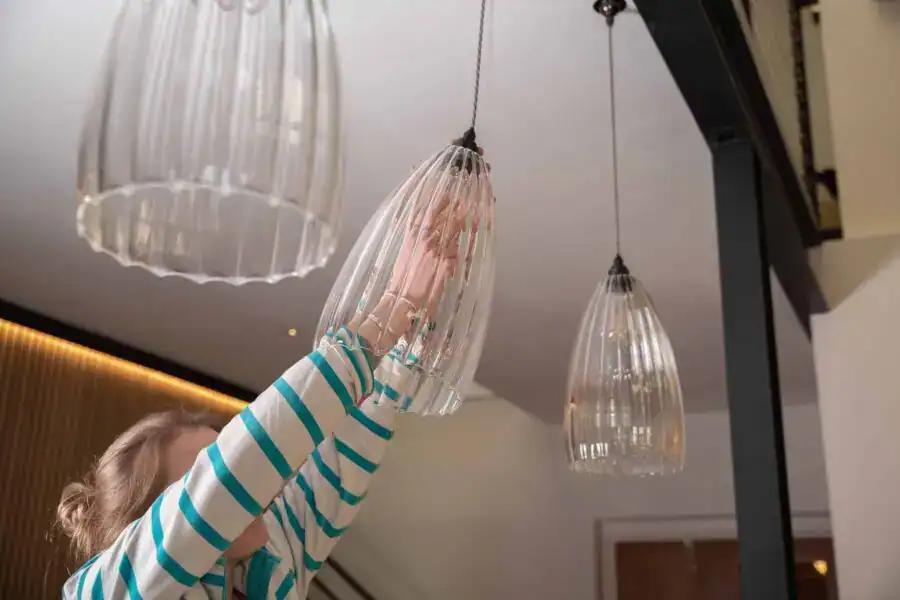 Elegant glass pendant lights in a modern interior setting.