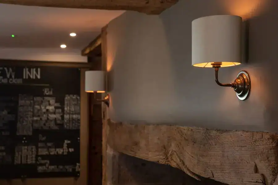 Elegant wall-mounted lamps in a cozy interior setting.