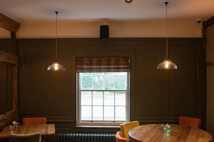 Elegant pendant lighting in a cozy dining area.