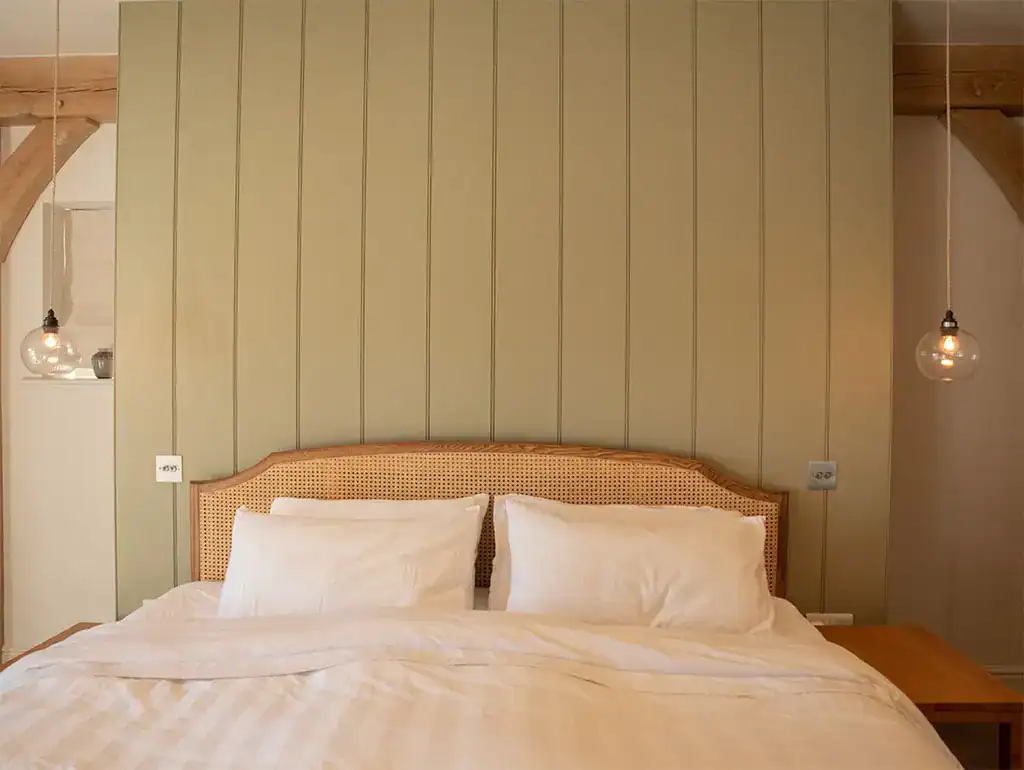 Elegant bedroom lighting with pendant lamps.