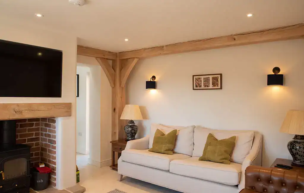 Modern living room with wall-mounted lights and cozy sofa setup in a stylish home interior.