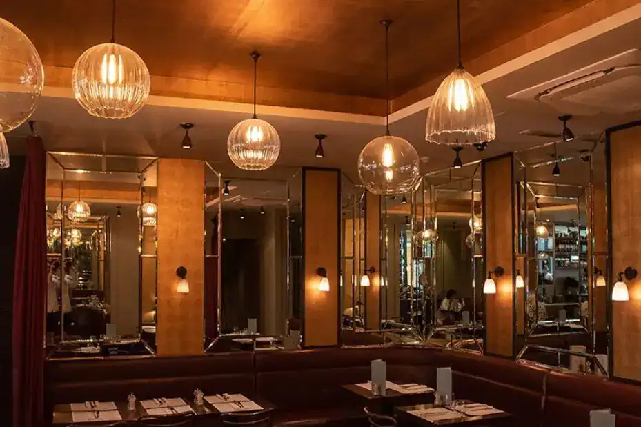 Stylish pendant lights illuminating a modern dining area.