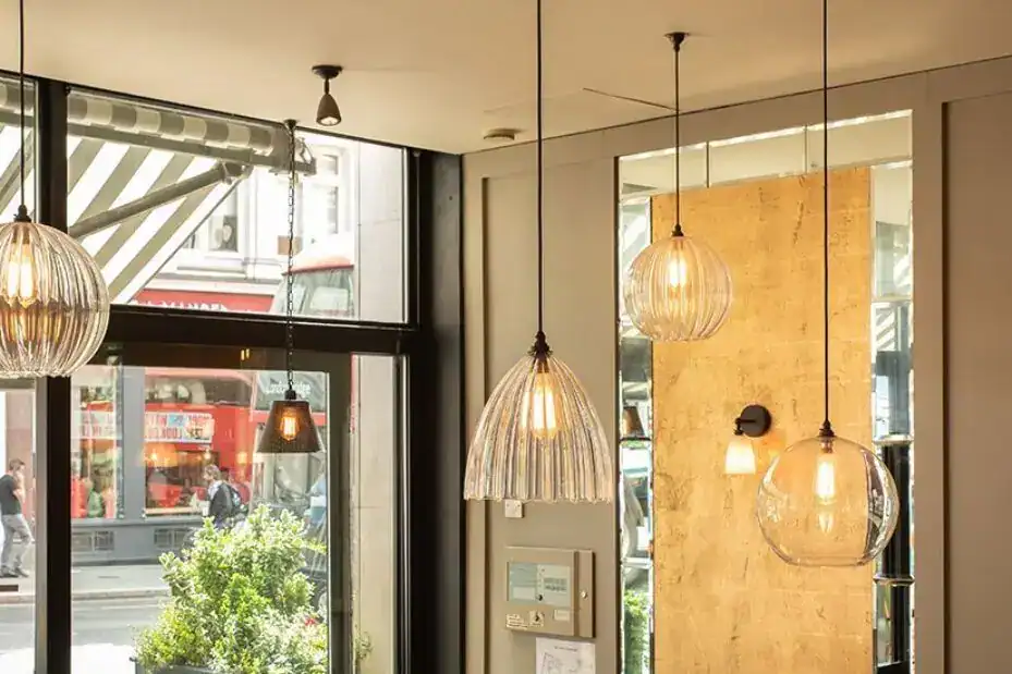 Pendant lighting fixtures hanging in a contemporary interior space.