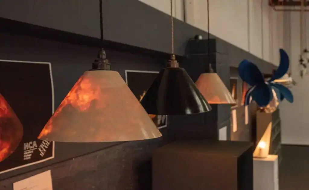 Elegant pendant lighting display at Fritz Fryer Lighting UK showroom.