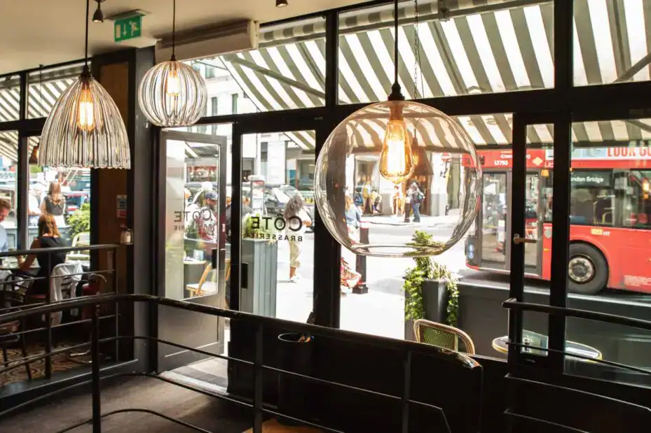 Elegant pendant lighting in a modern cafe setting.