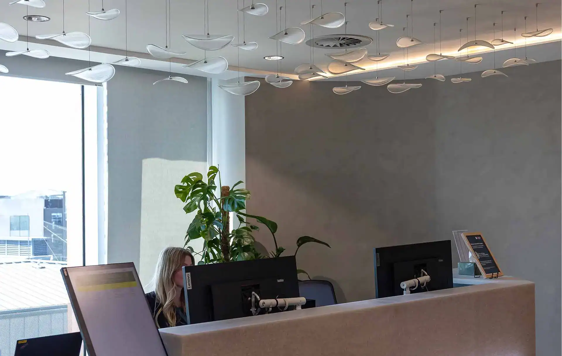 Modern office lighting fixtures with decorative ceiling lights in a contemporary workspace at Fritz.