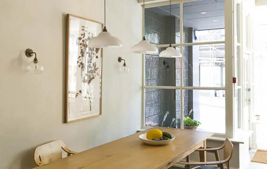Modern pendant lighting over dining table.