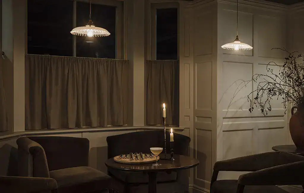 Elegant living room with modern pendant lighting.