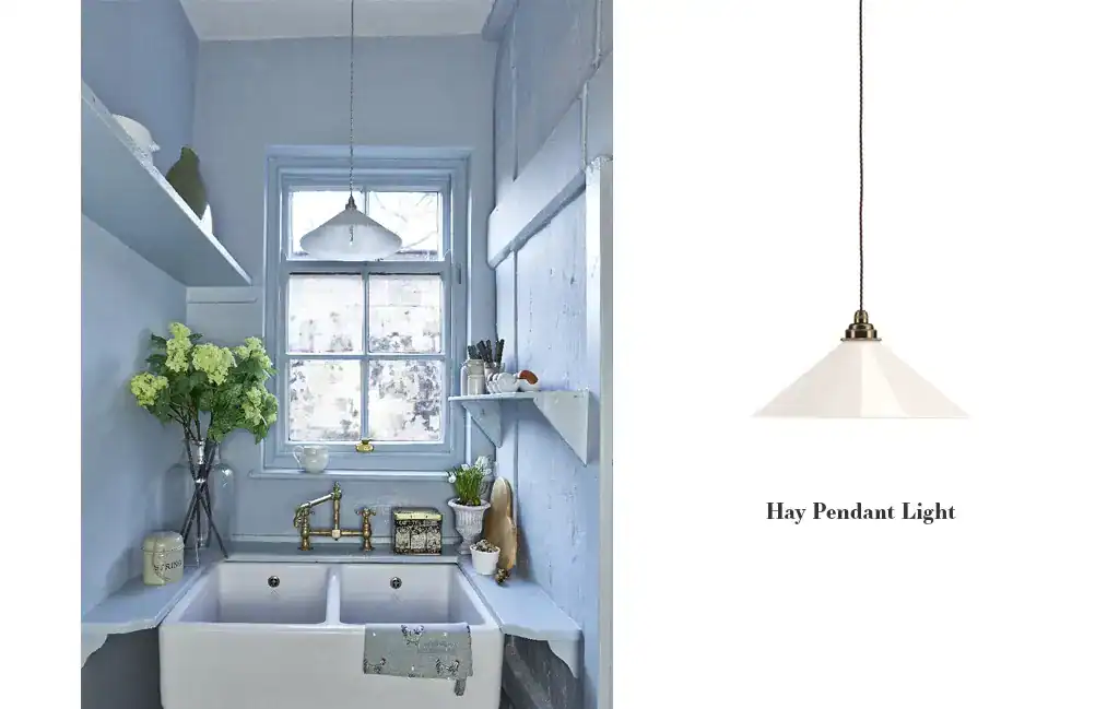 Hay Pendant Light - Modern white pendant light hanging over a kitchen sink.