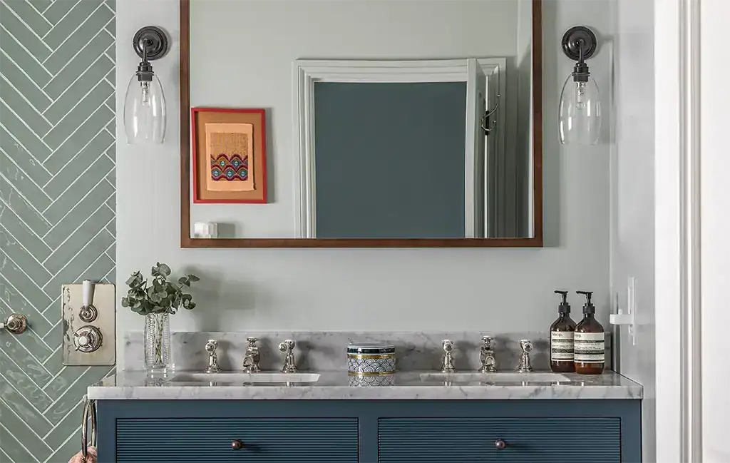 Elegant bathroom vanity with wall-mounted lighting fixtures.