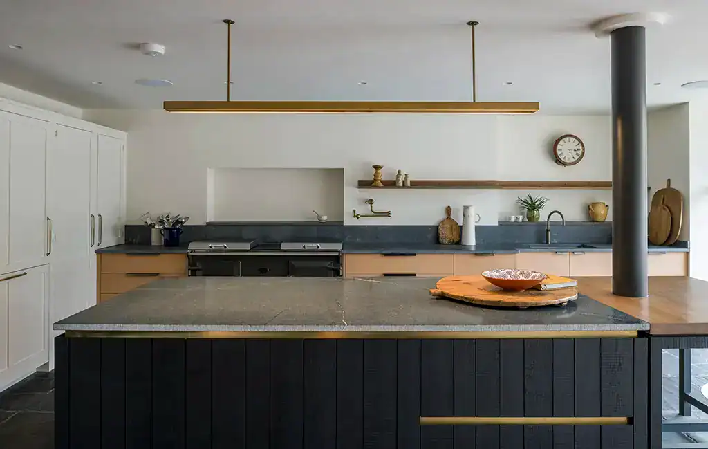 Pendant lighting over kitchen island with sleek design.