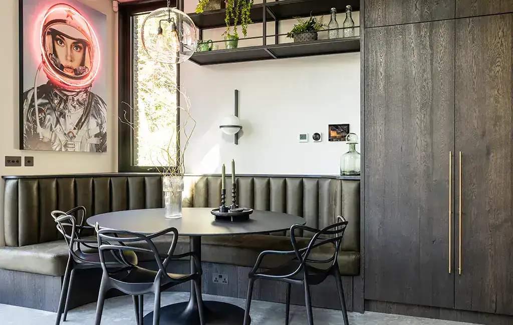 Modern dining area with stylish lighting fixtures.
