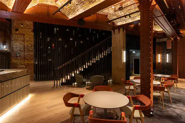 Modern industrial lighting in stylish restaurant interior.
