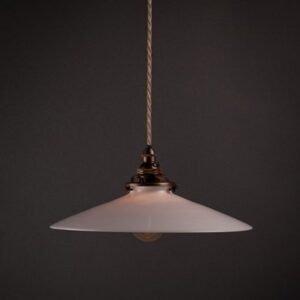 Pendant light fixture with a white shade and braided cord.