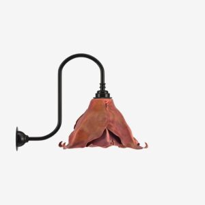 Modern lamp with a fabric shade and black metal arm, stylish lighting fixture.