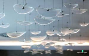 Modern office featuring bespoke lighting installation by Fritz Fryer Lighting.