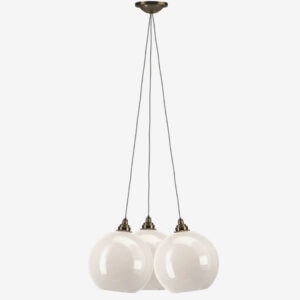 Modern three-light pendant fixture with white glass globes and brass fittings.