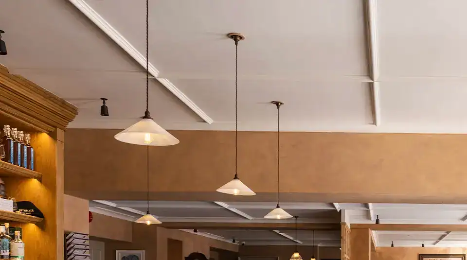 Indoor ceiling pendant lights in a contemporary setting.