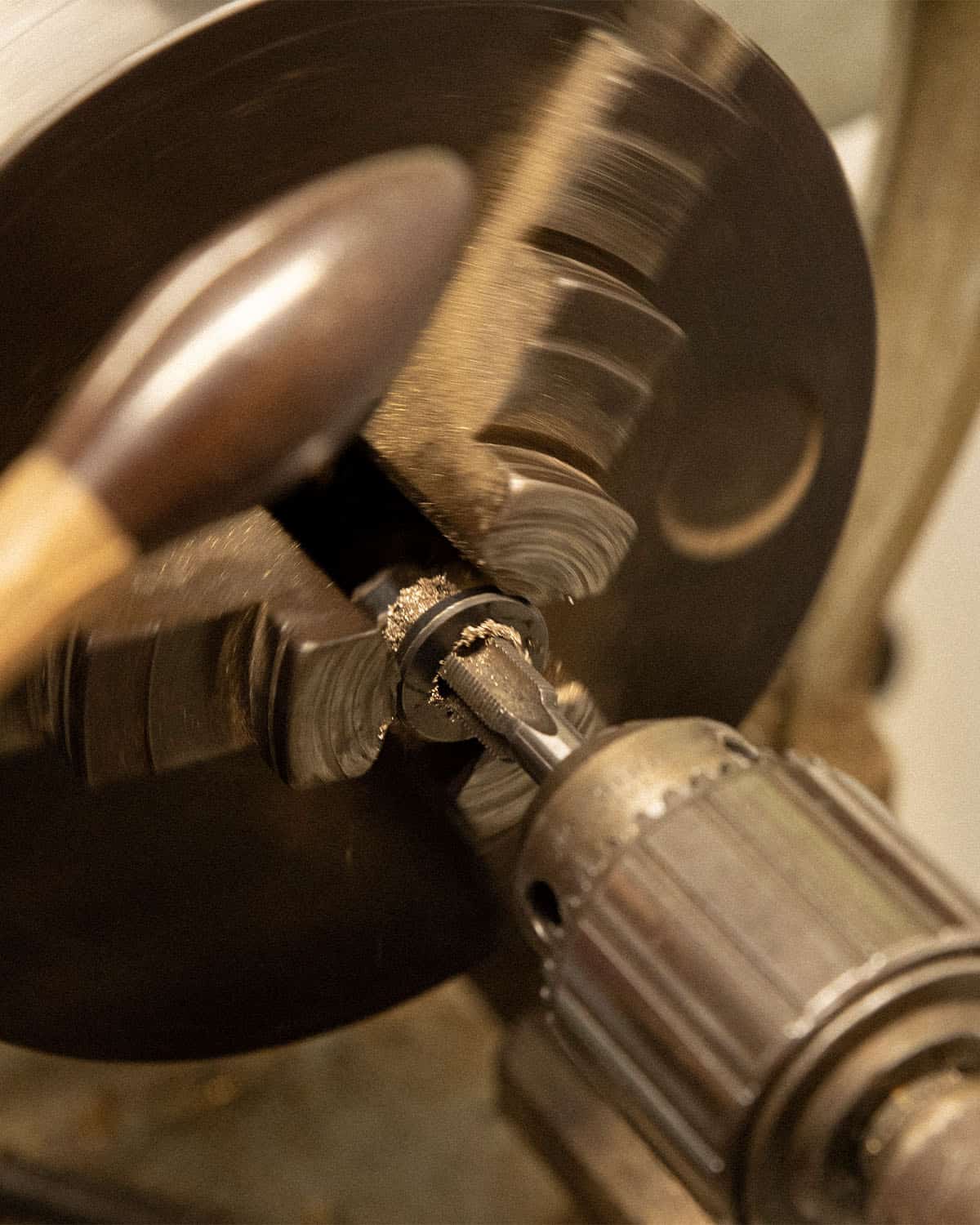 Close-up of a metalworking lathe machine in operation.