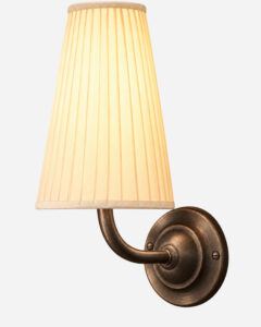 Elegant wall light with pleated lampshade for modern interiors.